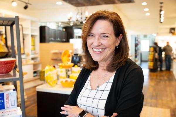 A female employee smiling in a retail shop