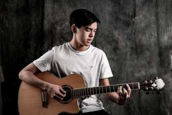 young man playing guitar