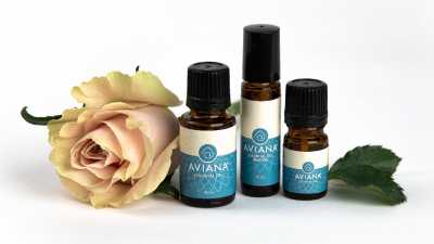 aviana essential oils next to a rose