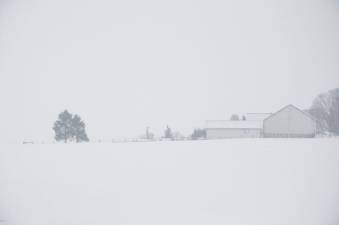 a farm in winter with low visibility
