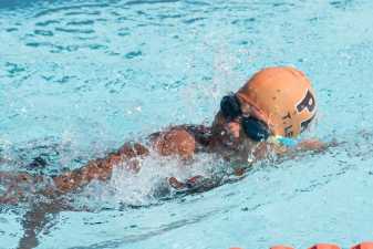 a child swimming at a swim meet