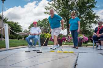 playing shuffleboard at a retirment community