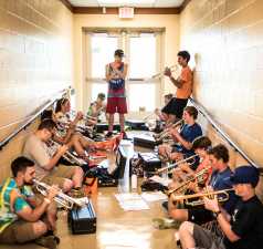 high school band practice in a hallway