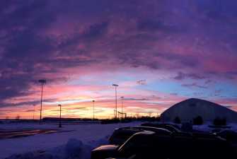 looking over a parking lot in the winter at dusk