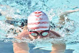 a boy in a swimming cap