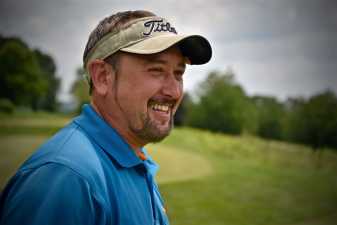 a golfer smiling