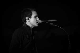 black and white photo of a man singing