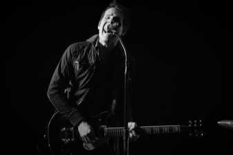 black and white photo of a man singing