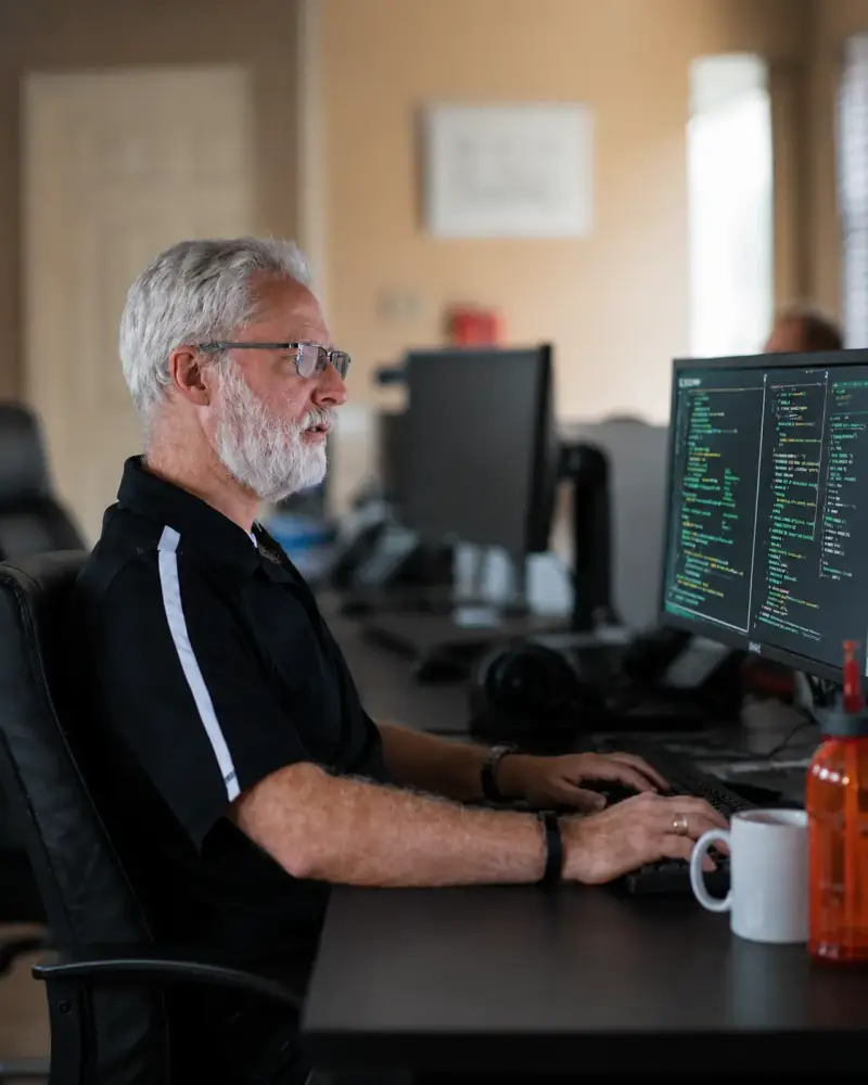 Why choose Sharp Innovations — team collaboration in a modern office environment