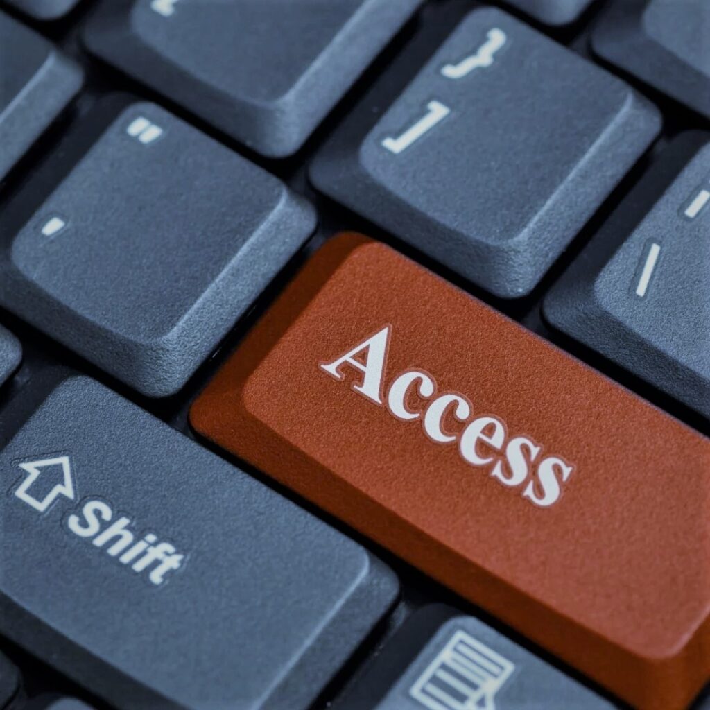 closeup of a keyboard with a red access button